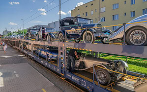 Train carrying vintage cars